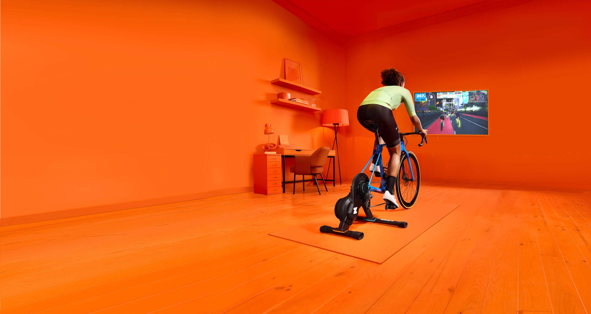 Cyclist on bicycle using Zwift smart trainer and app